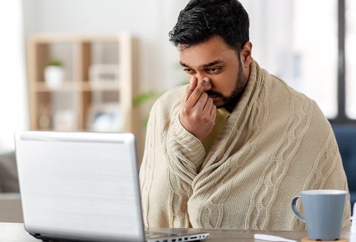 Sick man looking up his illness online